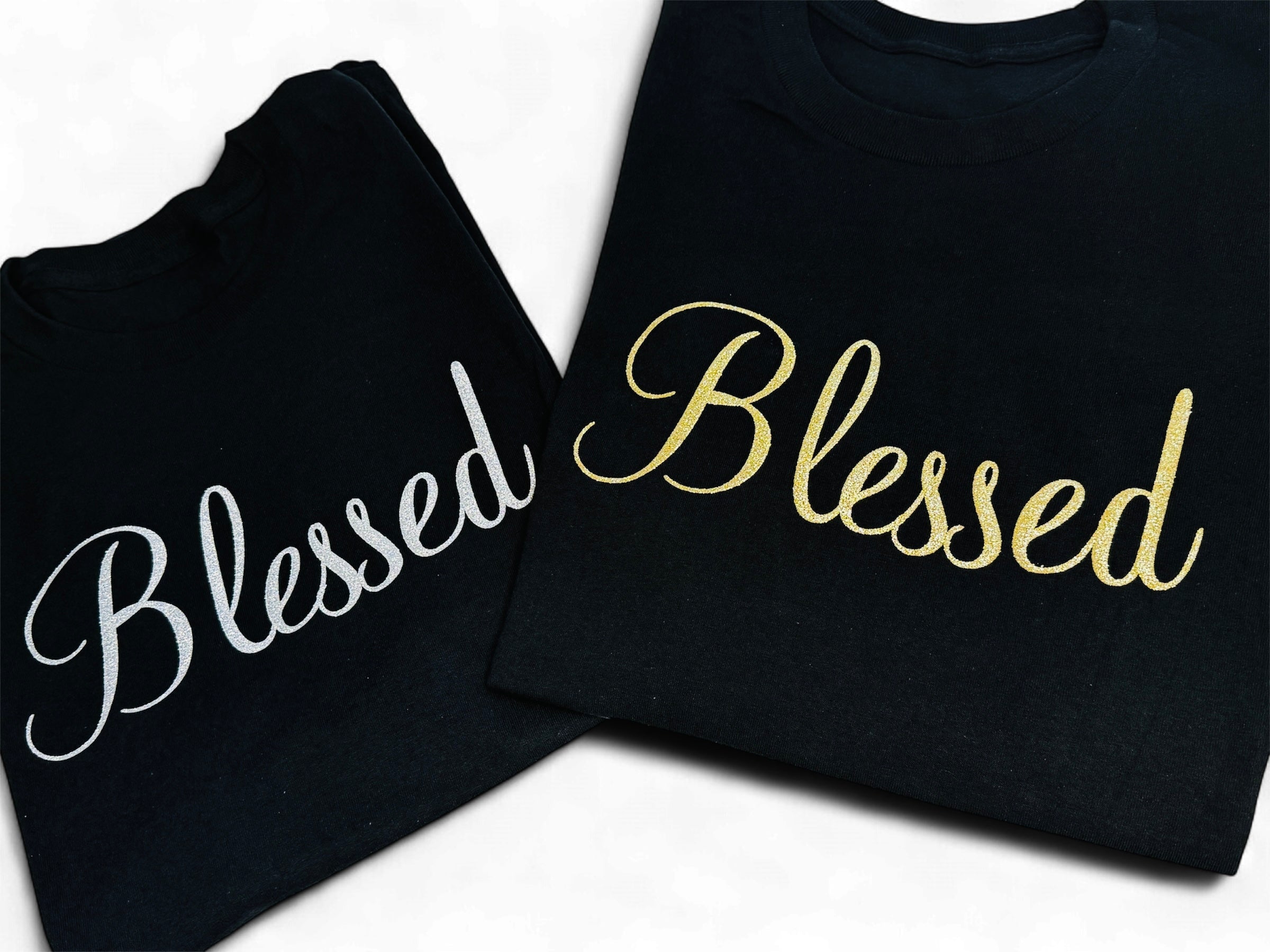 Two black sweatshirts with 'Blessed' text in gold and white on a white background