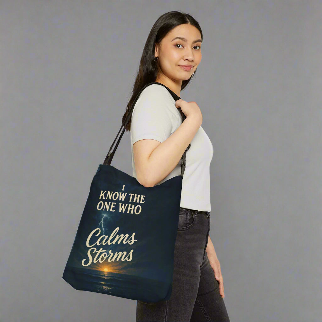 Woman holding a tote bag with motivational quote on a white background