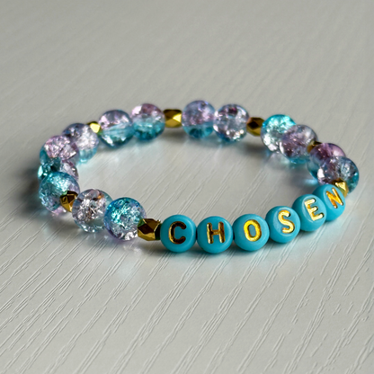 Bracelet with colorful beads and 'CHISEN' beads on a light gray background