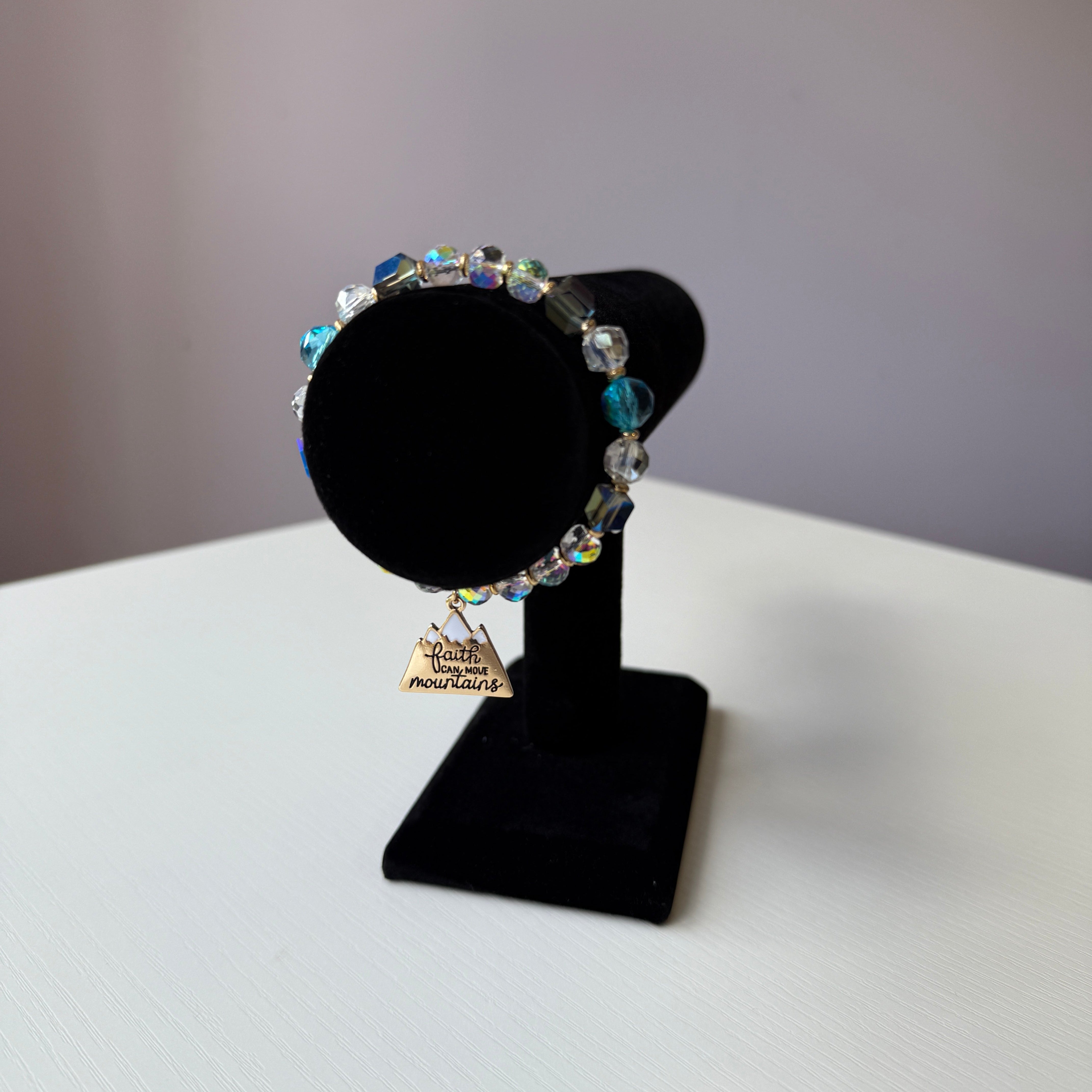 Black bow tie with colorful beads on a white background