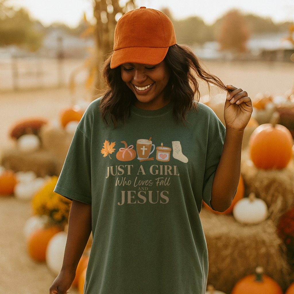 Woman wearing a green t-shirt with a religious message, standing in a pumpkin patch.