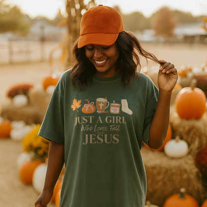 Woman wearing a green t-shirt with a religious message, standing in a pumpkin patch.