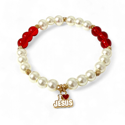 Bracelet with pearls, red beads, and 'I ❤️ JESUS' charm on a white background