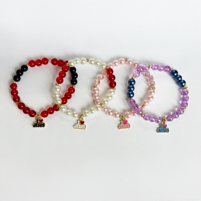 Set of four beaded bracelets with 'I ❤️ JESUS' charms on a white background