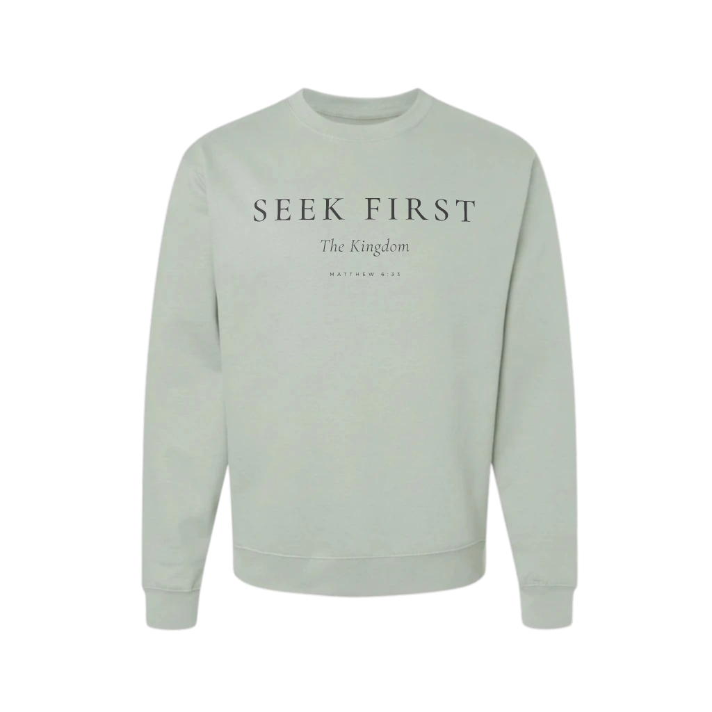 Light green sweatshirt with 'Seek First The Kingdom' text on a white background