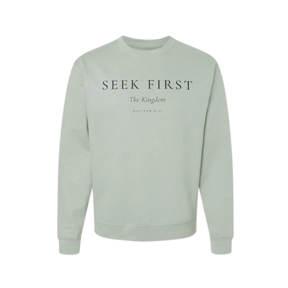 Light green sweatshirt with 'Seek First The Kingdom' text on a white background