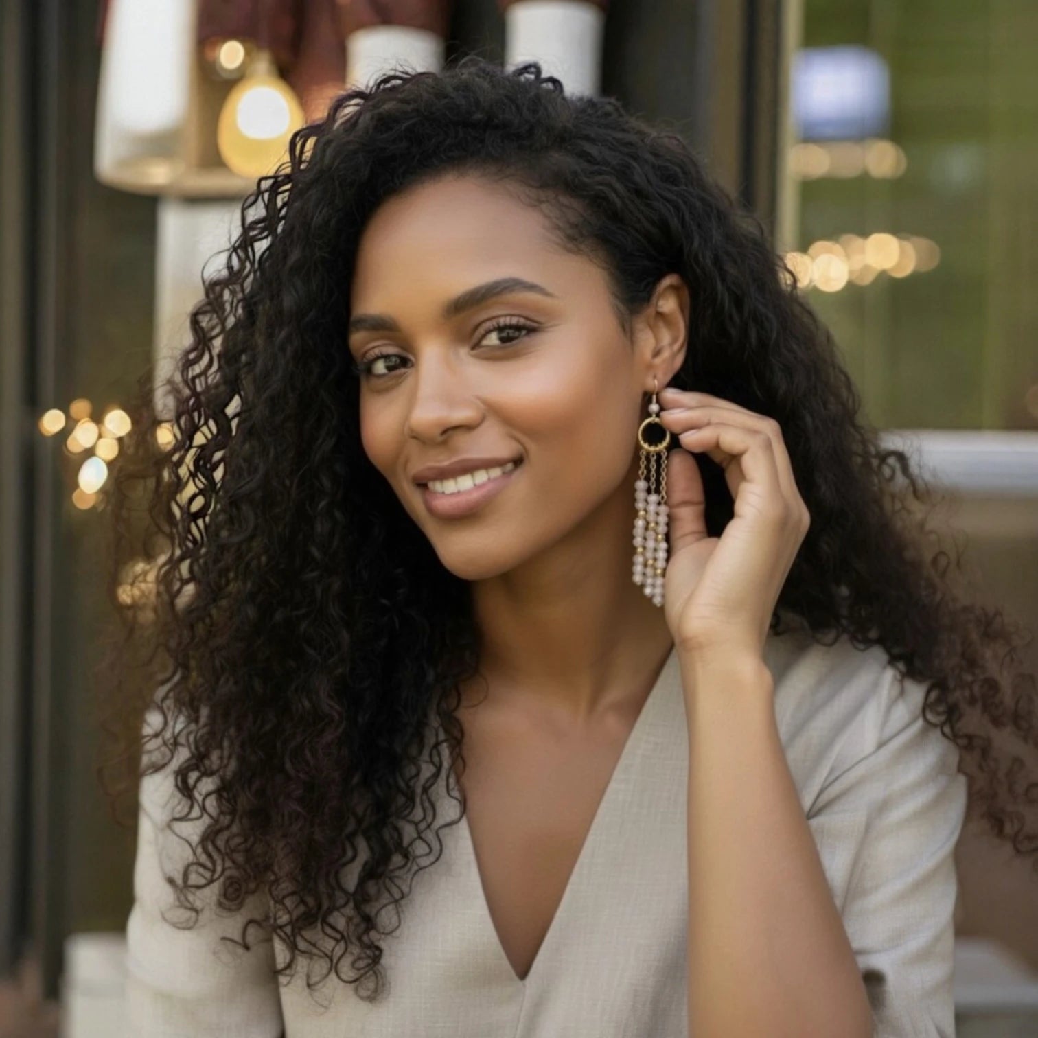 Woman wearing earrings with a blurred background